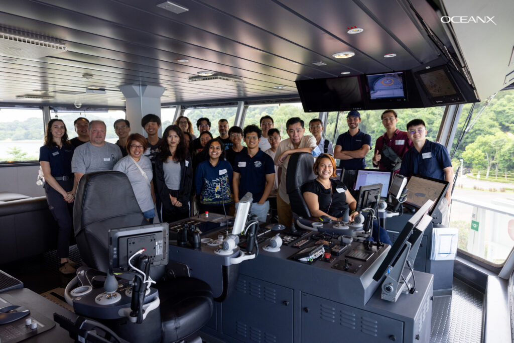 A group photo on the bridge deck of the ship. Photo credit: OceanX