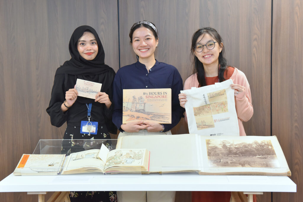 Authors of the book, (left to right) Maimon Hussin, Kathy Poh and Jeslynn Teo, posing with their book, postcards and tote bag. Photo courtesy of NUS Libraries.