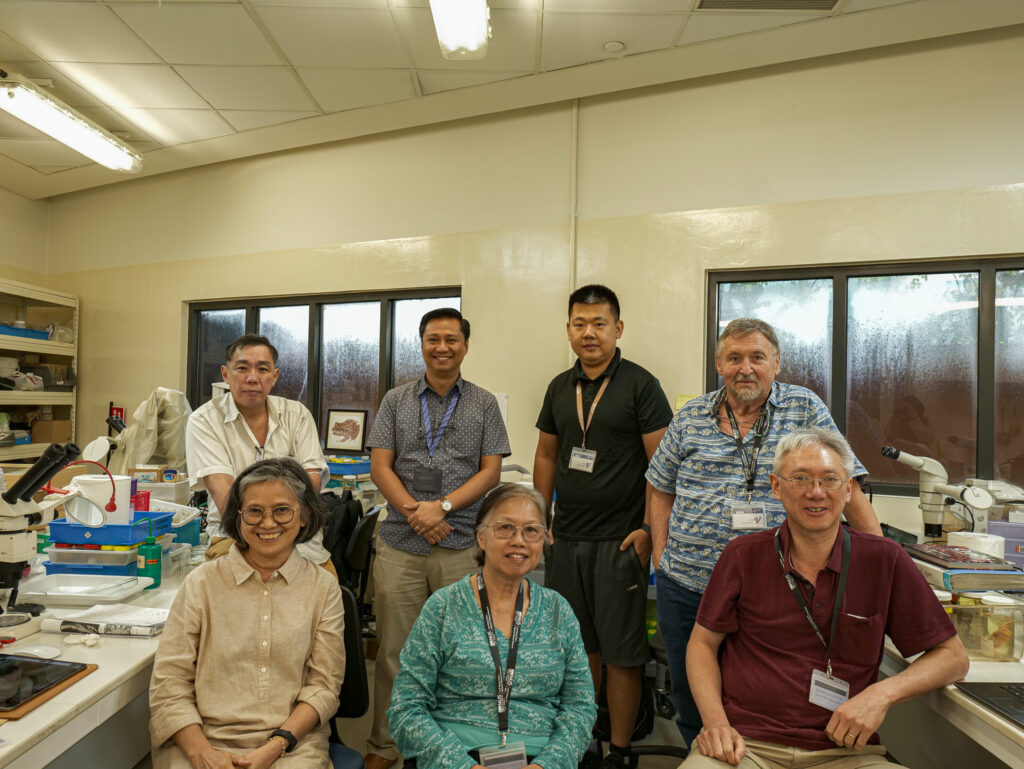 Prof Peter Ng and Dr Peter Davie standing with other crustacean scientists in one of the Museum’s laboratories, during Dr Davie’s most recent visit in November 2023. Clockwise from top left: Prof Peter Ng, Dr Jose Christopher Mendoza, Dr Liu Xinming, Dr Peter Davie, Dr Shane Ahyong, Dr Daisy Wowor, Dr Dwi Listyo Rahayu.